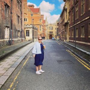 Rachel | Freelance medical and healthcare copywriter | Standing in a London street holding a coffee